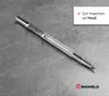 A metal scriber tool is shown on a metallic surface, with a text overlay indicating its purpose. Produktbild-Vorschau