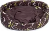 A brown oval dog bed with a pattern of white and yellow letters on a white background. Produktbild-Vorschau