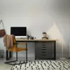 A modern home office setup with a desk, chair, computer, and floor lamp. Anteprima dell’immagine prodotto