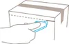 A hand is shown using a blue utility knife to cut along a dashed line on a white cardboard box. Produktbild-Vorschau