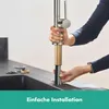 A person is installing a kitchen faucet. Produktbild-Vorschau
