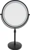 A black, illuminated makeup mirror with a round reflective surface and a stand. Podgląd zdjęcia produktu