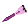 A handheld garment steamer with a brush attachment. Náhled obrázku produktu