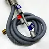 A close-up view of a coiled gray hose with metallic fittings and colored labels. Produktbild-Vorschau