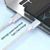 A close-up shot of two USB-C cables plugged into a laptop and a smartphone, with text overlays. Produktbild-Vorschau