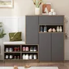 A shoe cabinet with a bench and storage compartments, filled with shoes and accessories. Voir les images du produit
