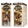 Two miniature book nook dioramas depicting a Parisian-themed arcade dating scene. Podgląd zdjęcia produktu