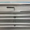 A close-up view of the metal frame and handle of an ironing board. Podgląd zdjęcia produktu