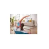 A woman is doing yoga in a living room, with a couch and plants in the background. Produktbild-Vorschau