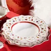 A close-up shot of stacked Villeroy & Boch Toy's Delight soup plates on a red tablecloth. Podgląd zdjęcia produktu