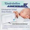 A baby sleeping on a pillow, with text and a pillow shown in the foreground. Produktbild-Vorschau