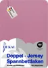 A pink fabric with a tag indicating it is made in Germany and a logo and text describing it as a double jersey fitted sheet. Produktbild-Vorschau