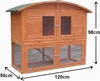 A wooden two-tier animal hutch with a green roof, shown with dimensions indicated by arrows and text. Anteprima dell’immagine prodotto