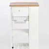 A close-up view of a white kitchen trolley with a wooden top, showing a drawer, a wire basket, and slatted shelves. Produktbild-Vorschau