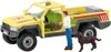 A toy veterinary truck with figures of a man and two dogs. Anteprima dell’immagine prodotto