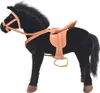 A plush toy horse with a saddle and bridle, shown from the side against a white background. Náhľad obrázku produktu
