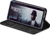 A smartphone in a black flip case is displayed on a white background, showing a movie streaming interface on its screen. Produktbild-Vorschau