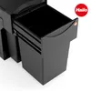 A black trash bin system with a pull-out drawer, shown in a studio setting against a white background. Voir les images du produit