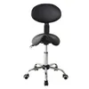 A black ergonomic saddle stool with a backrest and a silver base with wheels, isolated on a white background. Anteprima dell’immagine prodotto