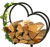 A heart-shaped firewood rack filled with logs and decorated with ivy. Produktbild-Vorschau