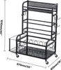 A black metal storage rack with multiple shelves and hooks, designed for storing gym equipment like yoga mats and weights. It has wheels for mobility. Náhľad obrázku produktu