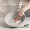 A hand is cleaning a pan with a cloth, highlighting ease of cleaning. Podgląd zdjęcia produktu
