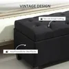A close-up view of a black upholstered storage bench with tufted detailing. Náhled obrázku produktu