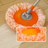 A close-up of a spinning mop head with orange and white fibers, resting on a wooden floor. A smaller inset image shows a detailed view of the mop fibers. Náhled obrázku produktu