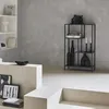 A modern living room with a black metal bookshelf filled with decorative items. Anteprima dell’immagine prodotto