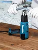 A person is using a heat gun to bend a pipe. Podgląd zdjęcia produktu