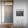 A modern front door with a mailbox mounted on the wall next to it. Produktbild-Vorschau