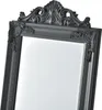 A close-up view of the ornate top corner of a dark gray mirror frame. Anteprima dell’immagine prodotto