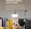 A studio setup with lighting equipment and two children engaged in an activity. Náhled obrázku produktu