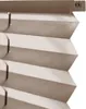A close-up view of a beige pleated blind. Produktbild-Vorschau