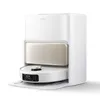 A white robot vacuum cleaner docked in its charging station. Produktbild-Vorschau