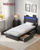 A bedroom scene featuring a bed with storage drawers and an LED-lit headboard. Produktbild-Vorschau