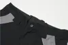 A close-up view of the waistband of black work pants with gray accents. Produktbild-Vorschau
