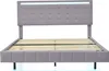 A grey upholstered bed frame with a tufted headboard featuring LED lighting and a wooden slat support system, shown against a white background. Produktbild-Vorschau