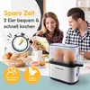 A couple is having breakfast with an egg cooker in the foreground. Produktbild-Vorschau