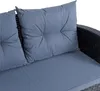 Close-up of a gray cushion on a black rattan sofa. Produktbild-Vorschau