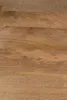 A close-up view of a wooden surface, showing the grain and texture of the wood. Voir les images du produit