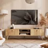 A modern living room scene featuring a TV stand with a television and decorative items. Produktbild-Vorschau