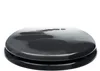 A black toilet seat with a decorative pattern resembling stepping stones on water. Produktbild-Vorschau
