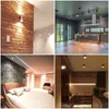 A collage of four different interior design scenes, showcasing various lighting solutions and room aesthetics. Produktbild-Vorschau