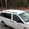 A white van with roof racks parked in a forest. Produktbild-Vorschau