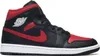 A studio shot of a single Nike Air Jordan 1 Mid sneaker. Náhled obrázku produktu