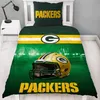 A Green Bay Packers themed duvet cover and pillow set on a bed. Náhled obrázku produktu