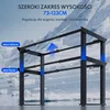 An adjustable desk frame shown against a snowy mountain backdrop with text overlays indicating its height range and adjustability. Podgląd zdjęcia produktu