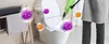 A person cleaning a toilet with a steam cleaner, surrounded by virus icons. Náhled obrázku produktu