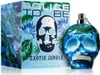 A perfume bottle and its box are displayed against a white background. The packaging features a jungle-like design with leaves and flowers in shades of blue and green, and a skull motif. The perfume bottle is also skull-shaped and decorated with a similar  Podgląd zdjęcia produktu